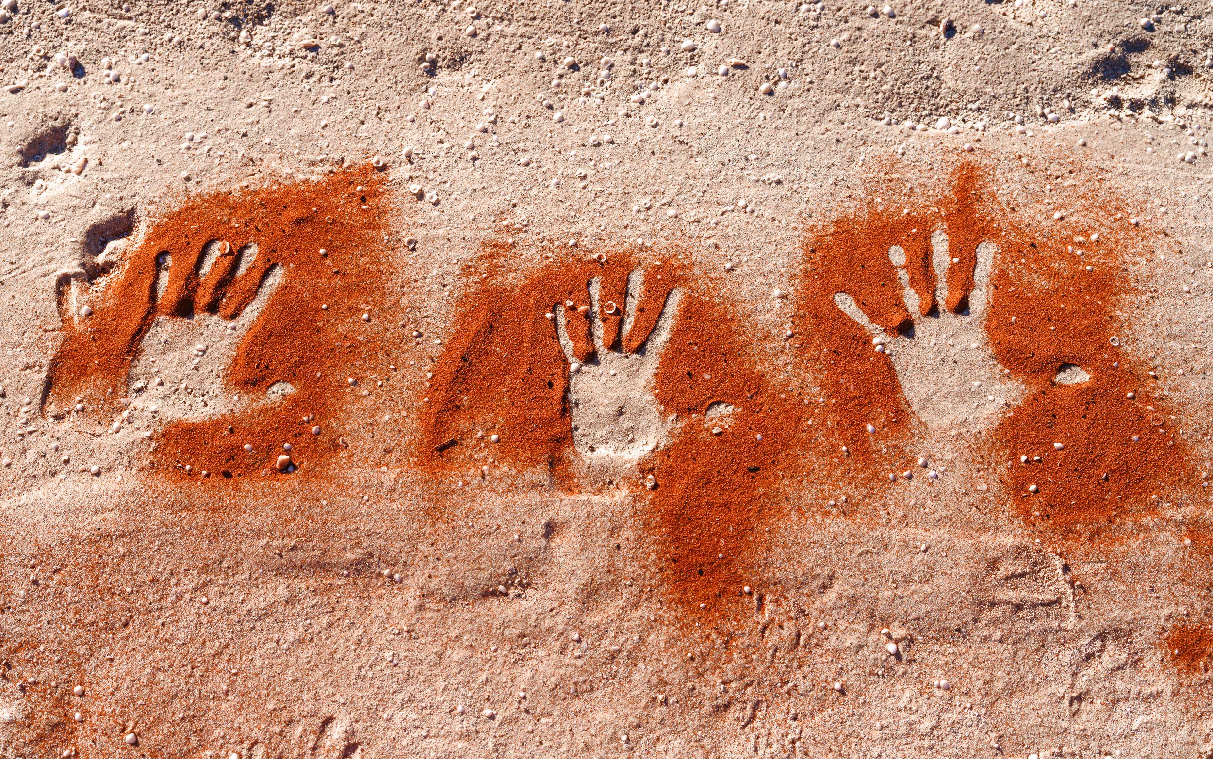 Wula Gura Nyinda Eco Cultural Adventures hands on sand